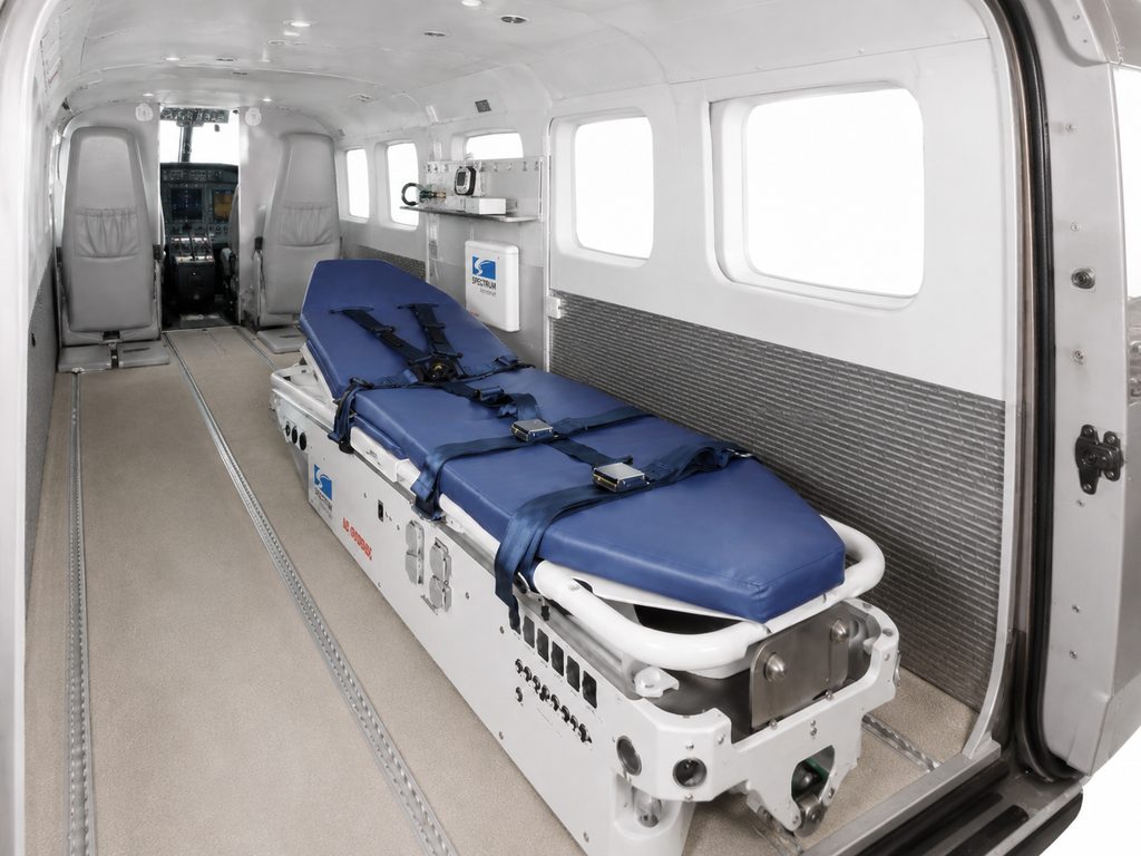Grand Caravan cabin with a medical stretcher fitted